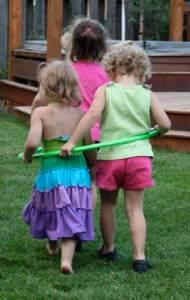 little girls playing hula hoop