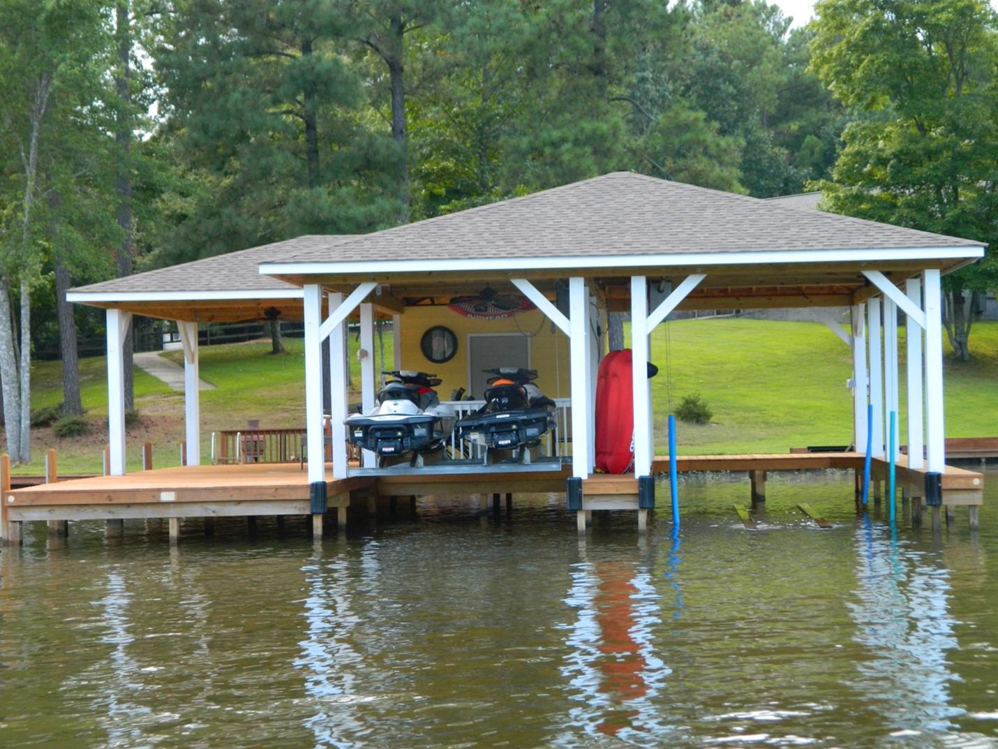 A boathouse with boats on the water