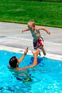 dad and kid in pool 