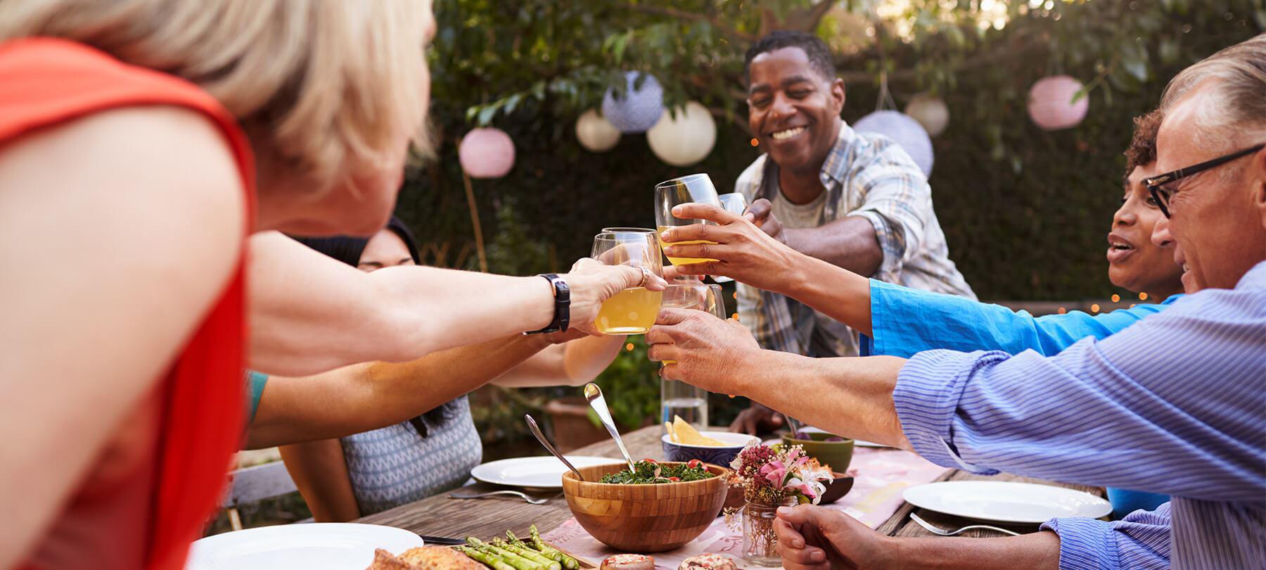 group of people clinking glasses