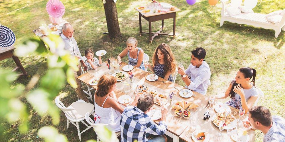 family enjoying meal outside 