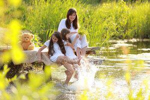 Family playing in still water