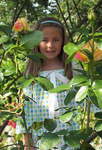 Girl behind flowers