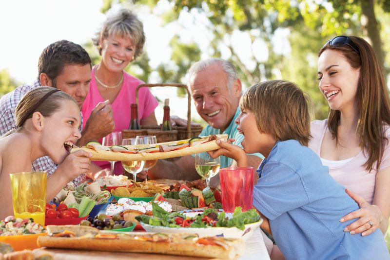 a family enjoying food outside