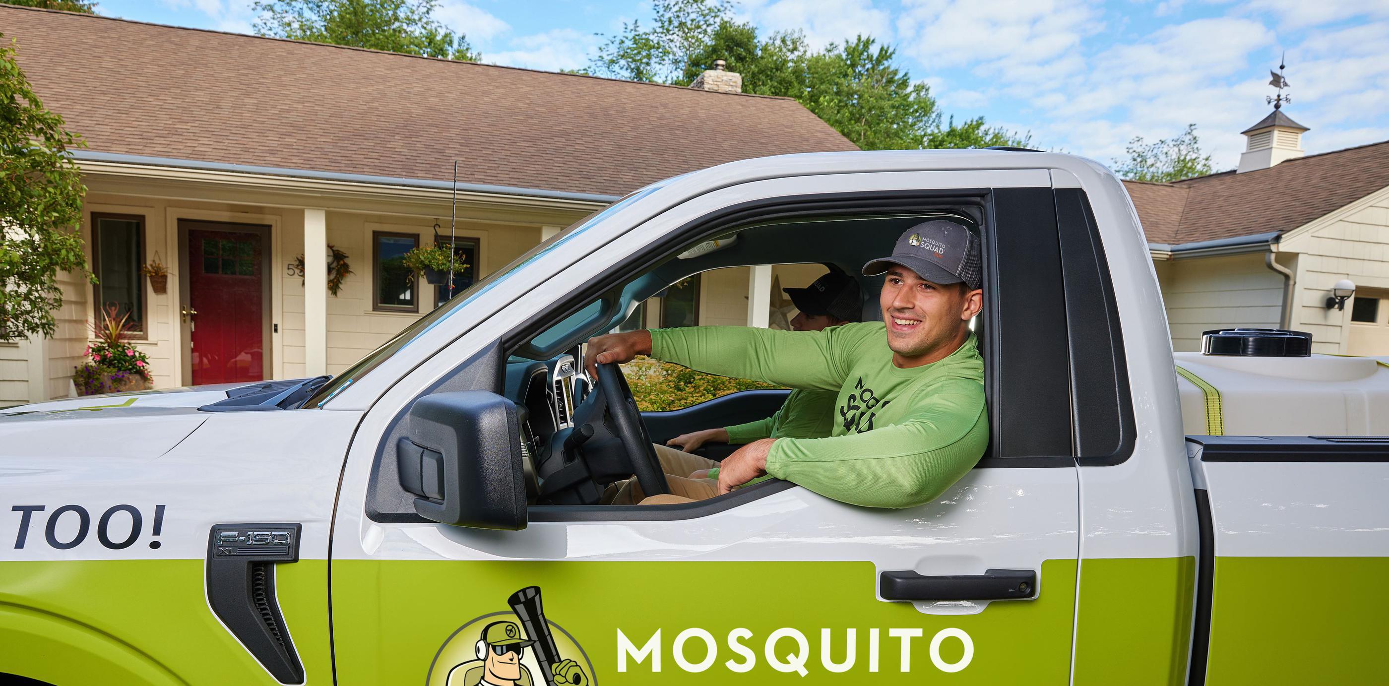 Mosquito Squad employee driving truck