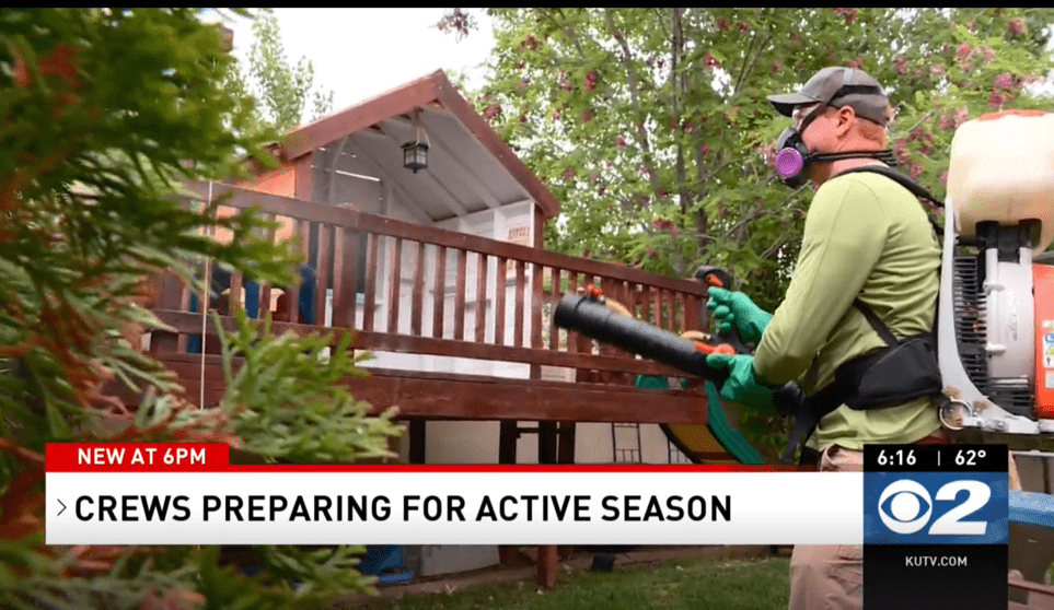 man spraying for mosquito season