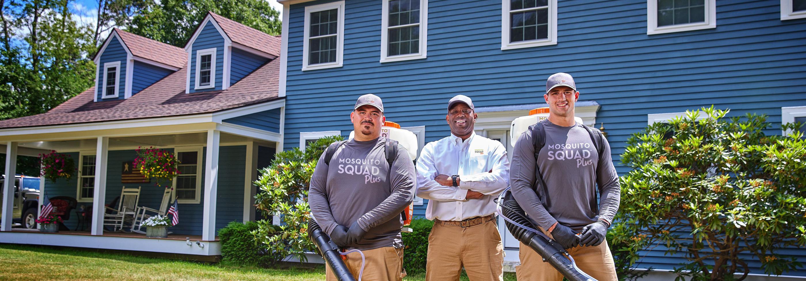 Three Mosquito Squad employees standing next to eachother
