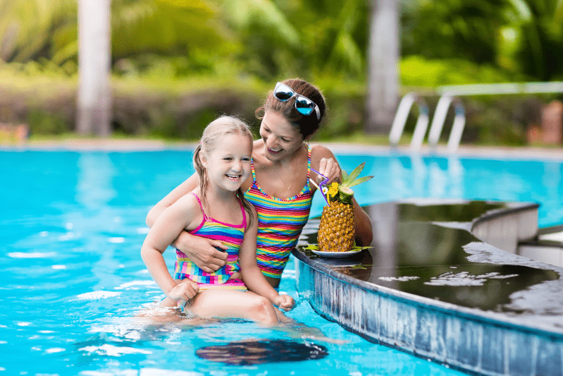 mom with child at pool