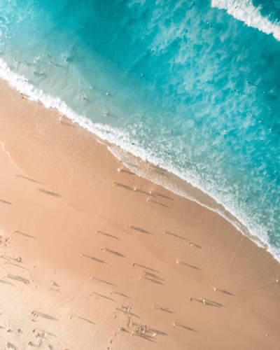 A picture of a ocean wave crashing on the shore 