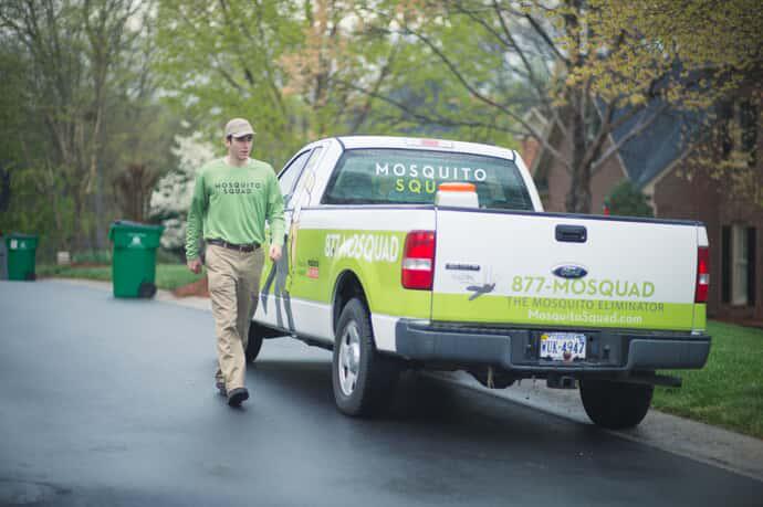 tech walking next to truck