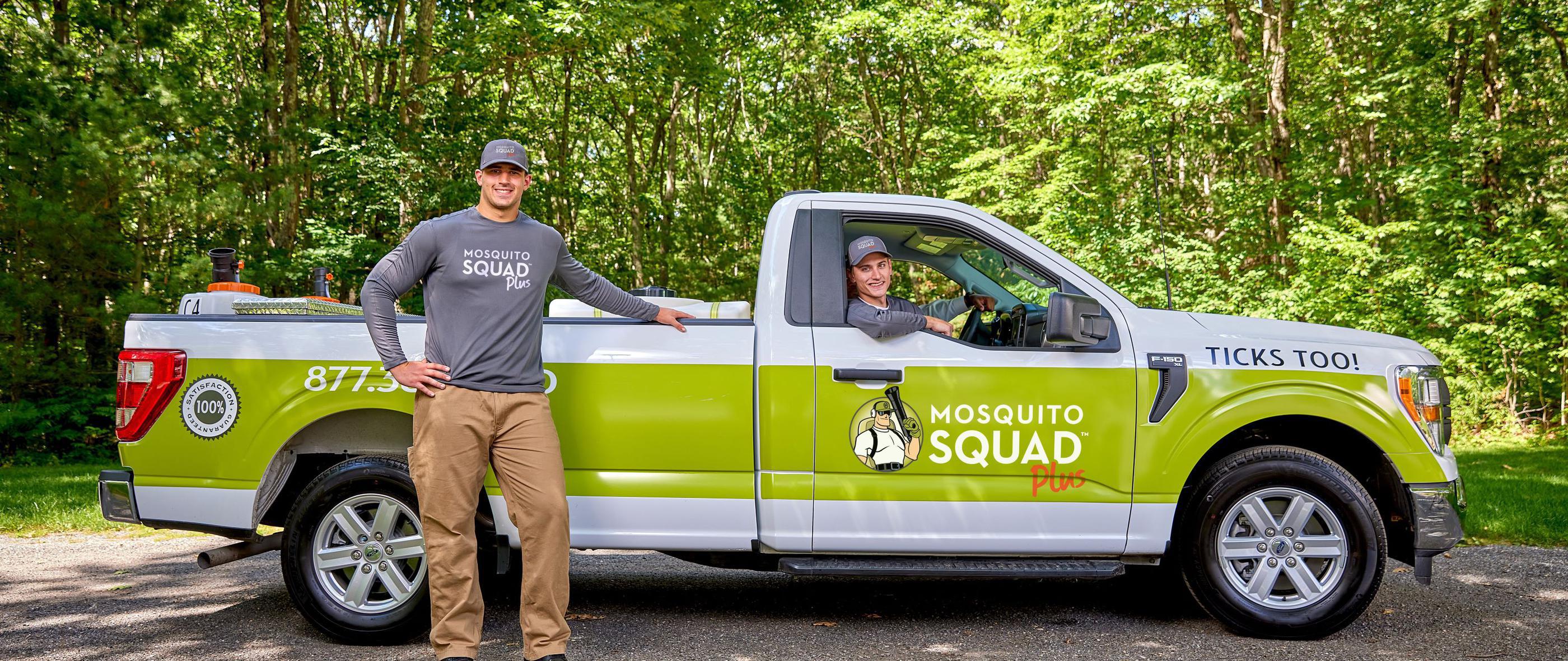 Mosquito Squad truck and two employees